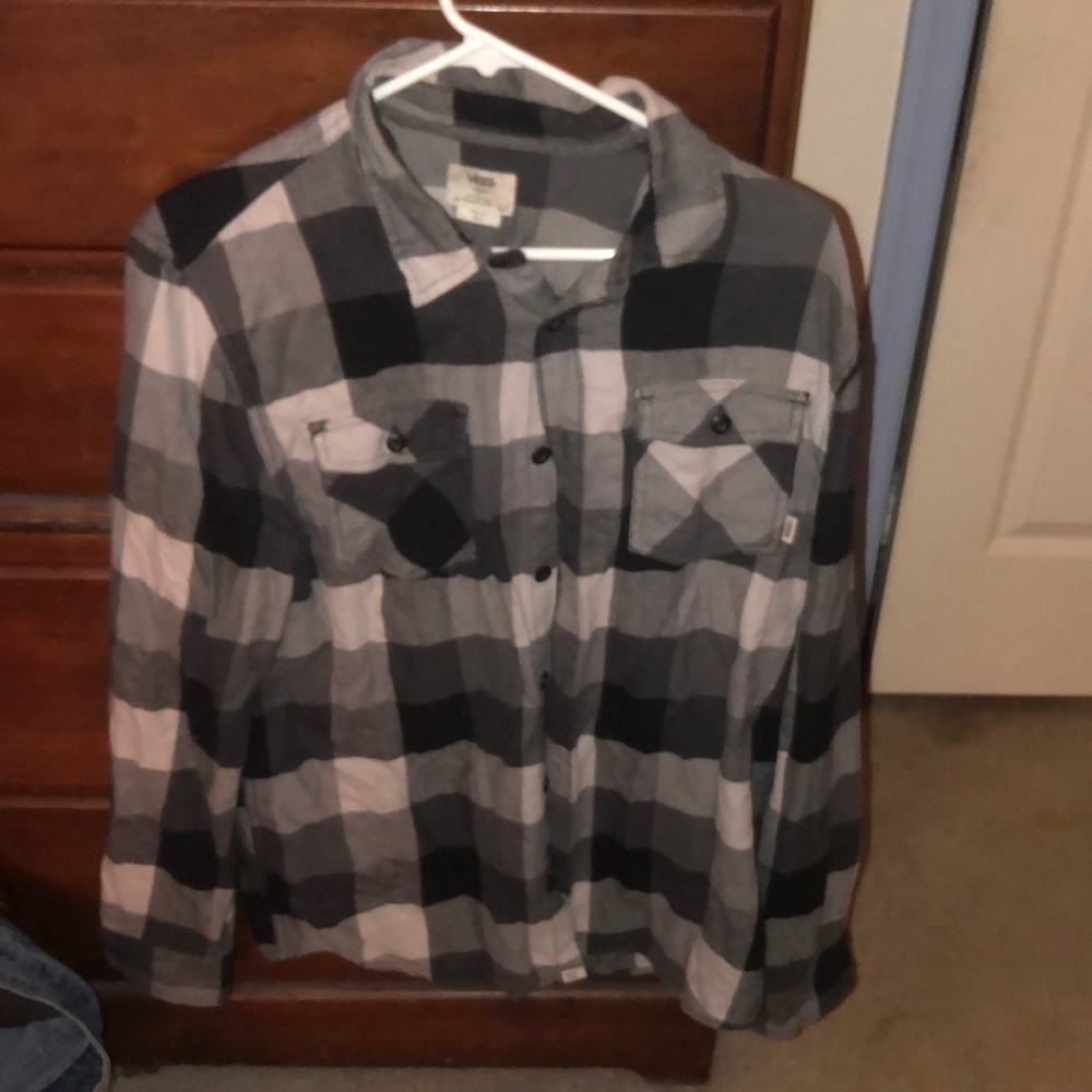 A button up plaid vans shirt.